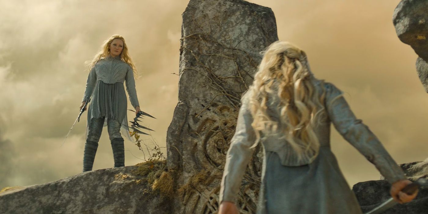 Galadriel (Morfydd Clark) staring up at Sauron, who has shapeshifted into Galadriel's image, standing above her in The Rings of Power Season 2 finale