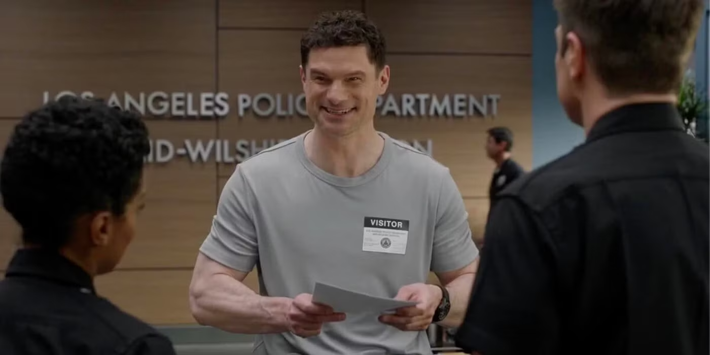 Skip Tracer Randy, with a visitor badge, smiles at Nolan and Harper in the LAPD office in 'The Rookie.'