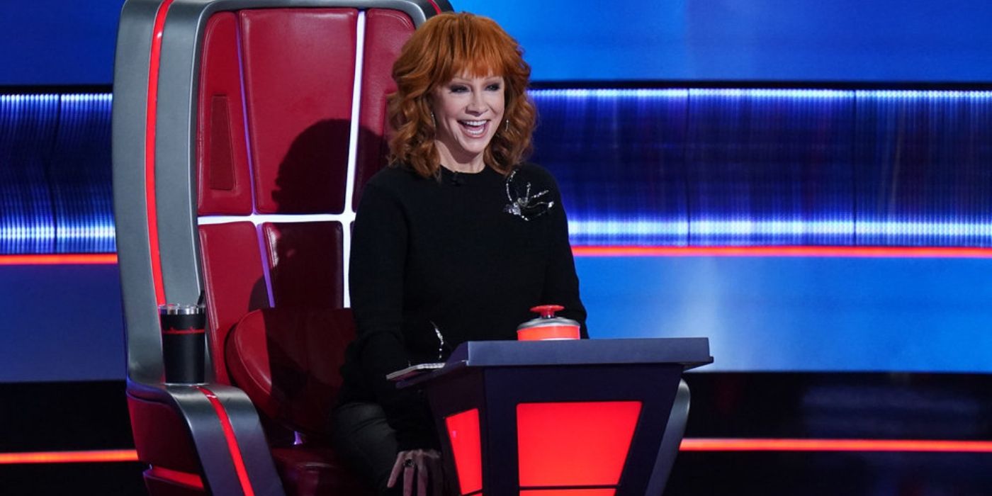 Reba McEntire smiles while watching the Battles on 'The Voice' Season 26.