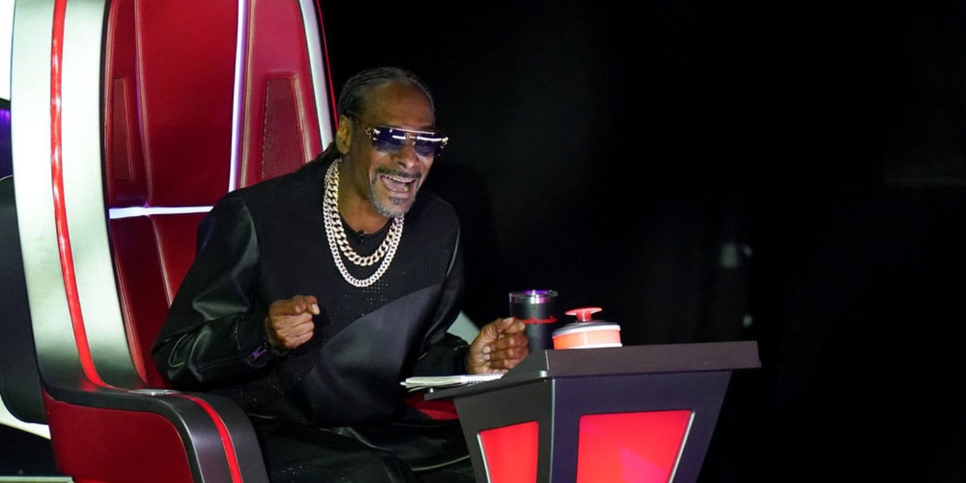 Snoop Dogg cheers during the Battle Rounds on 'The Voice' Season 26.