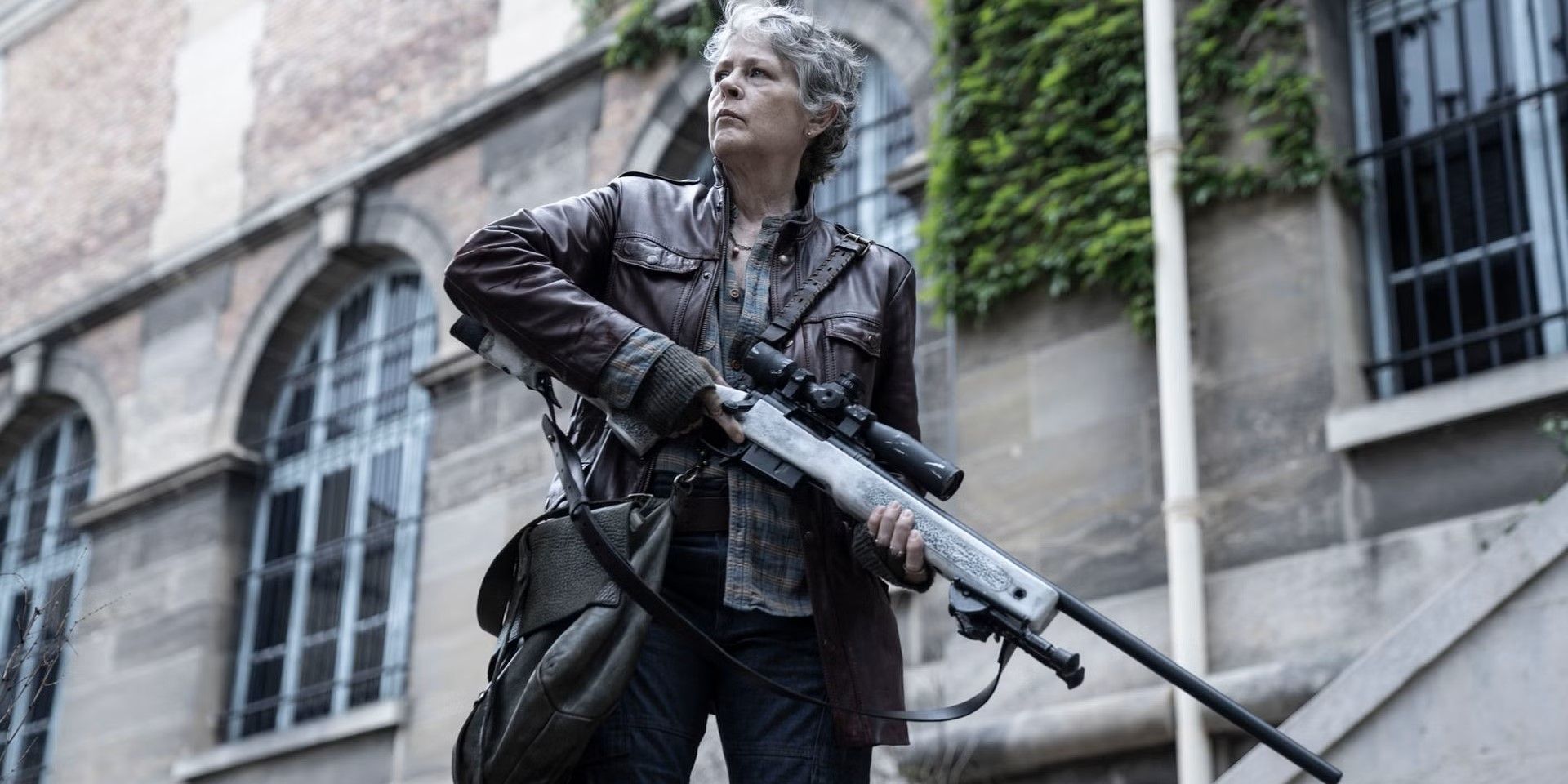 Carol (Melissa McBride) holds a rifle in the episode 