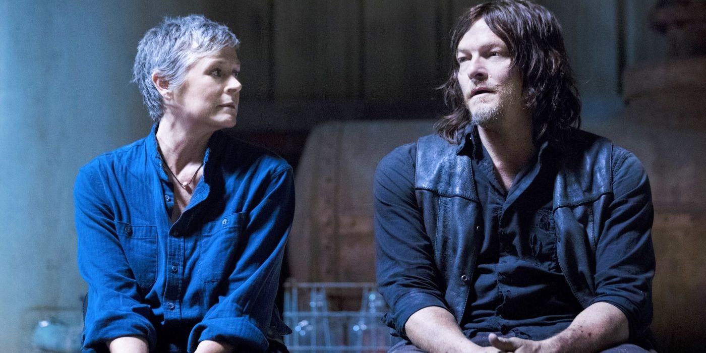 Melissa McBride's Carol sitting with Norman Reedus' Daryl in The Walking Dead 