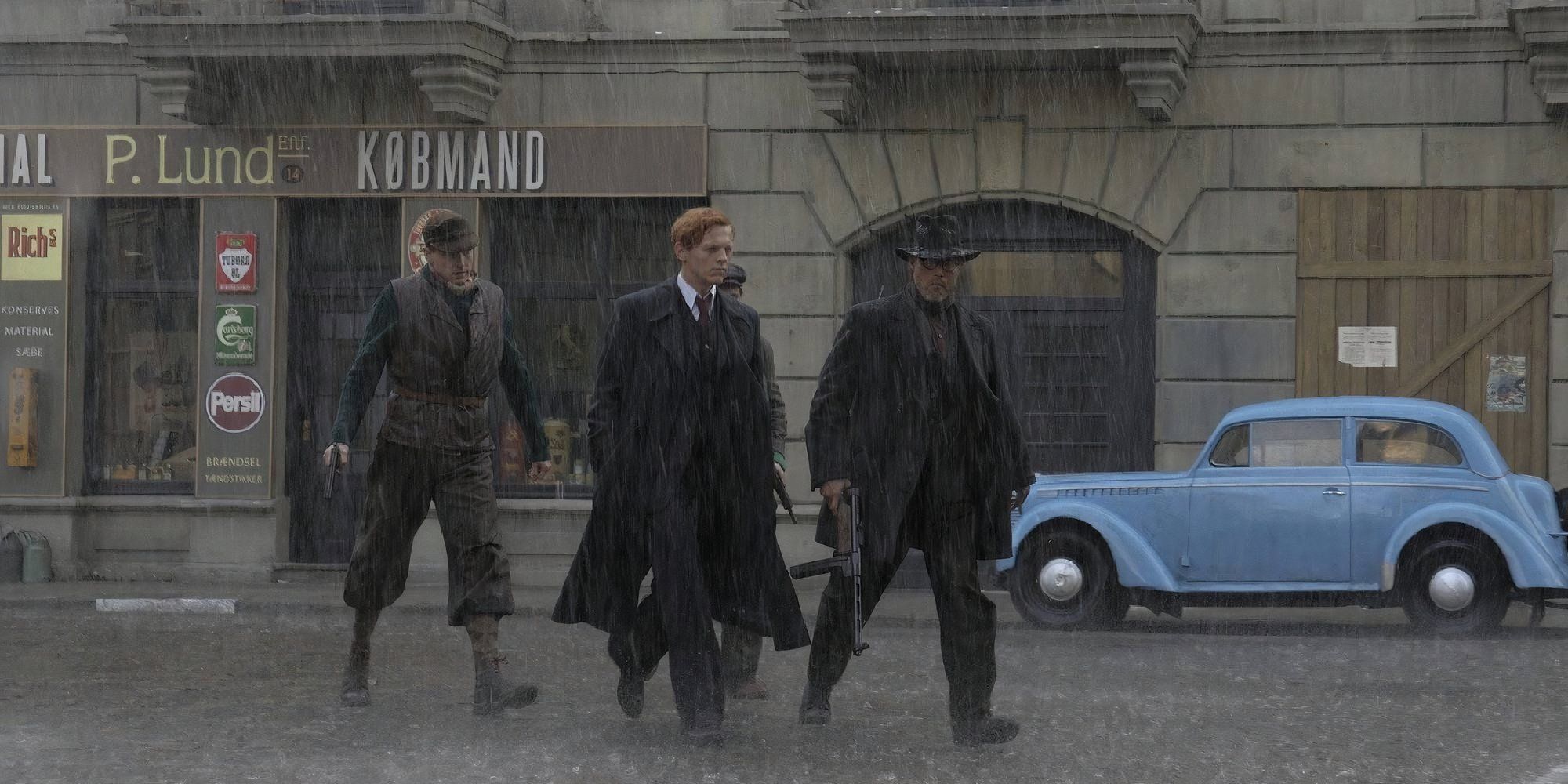 Three men walking on the street while it rains in Flame &amp; Citron