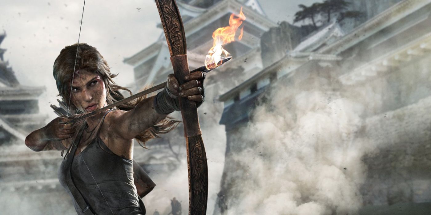 Lara Croft standing on the left and aiming a flaming arrow toward the right in the Tomb Raider 2013 video game