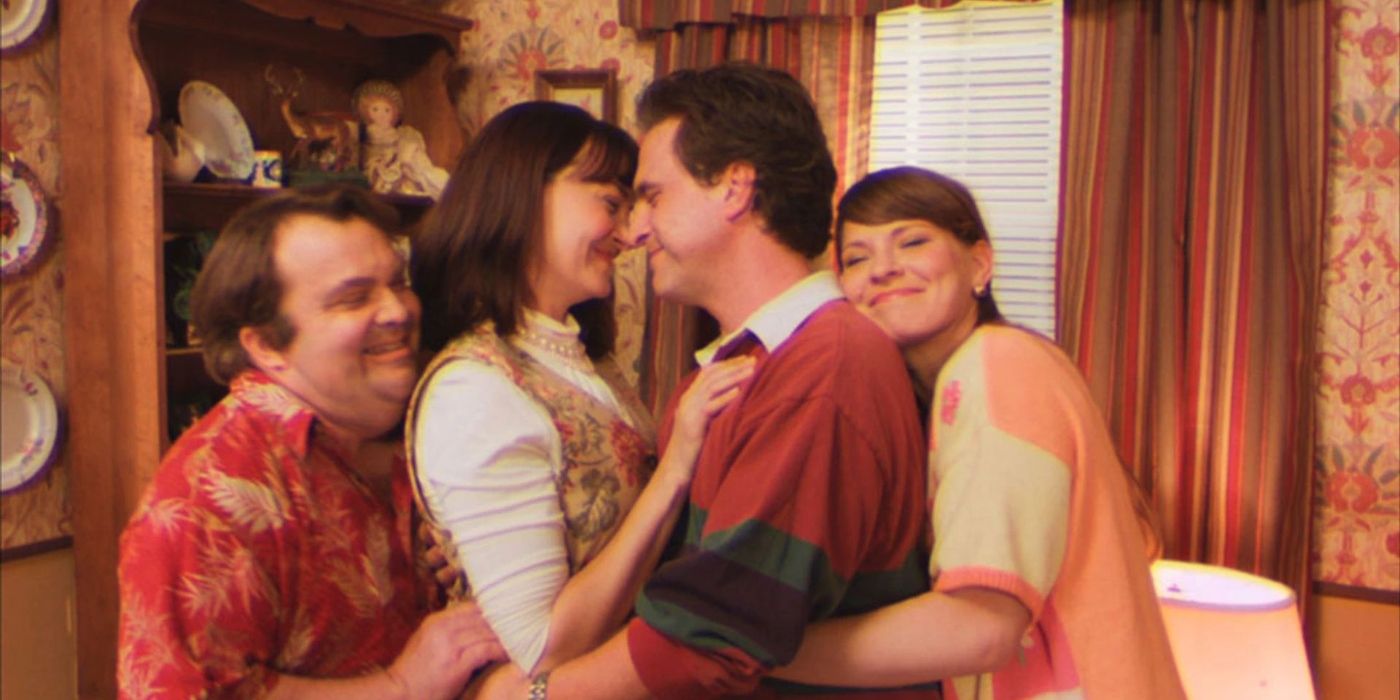 Two couples embracing in the Too Many Cooks video