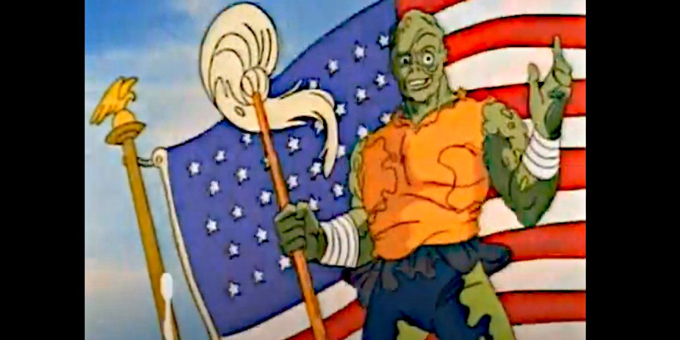 Toxie stands smiling before a large United States flag in 'Toxic Crusaders.'