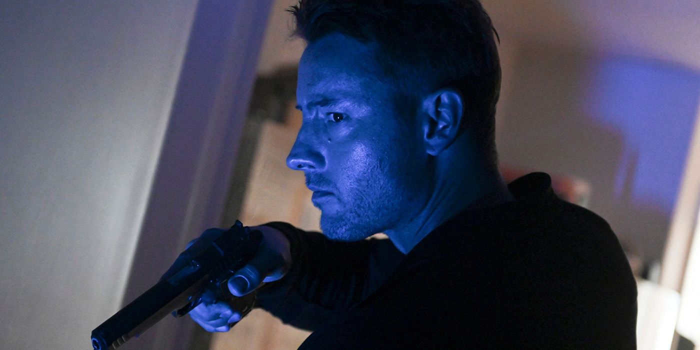 Colter Shaw (Justin Hartley) wanders a dark hallway with his gun on 'Tracker.'