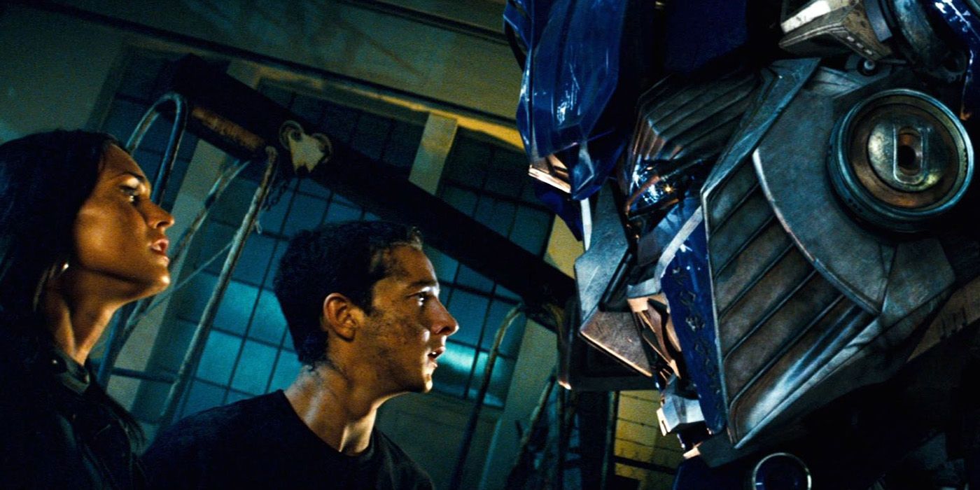 Megan Fox as Mikaela Banes and Shia LaBeouf as Sam Witwicky encounter the Autobot leader Optimus Prime (Peter Cullen) in 'Transformers' (2007).