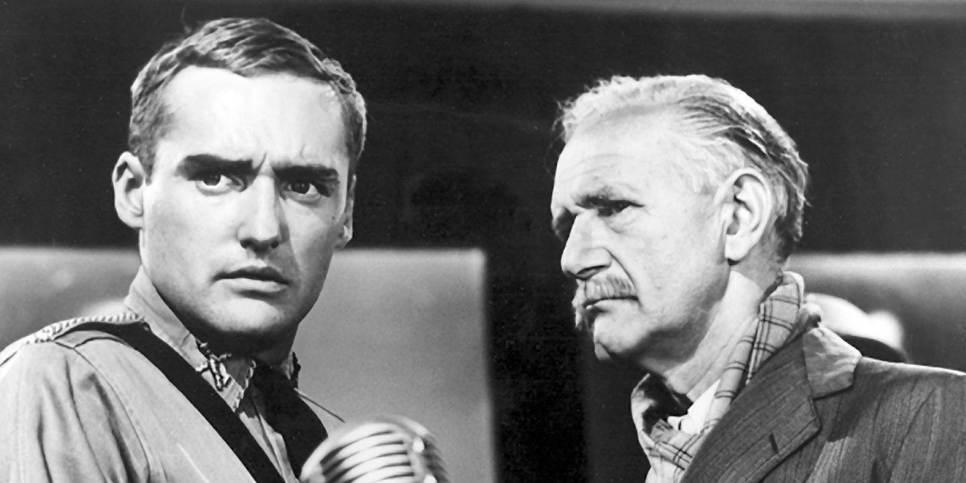 Dennis Hopper looks away as Ludwig Donath tries to talk to him