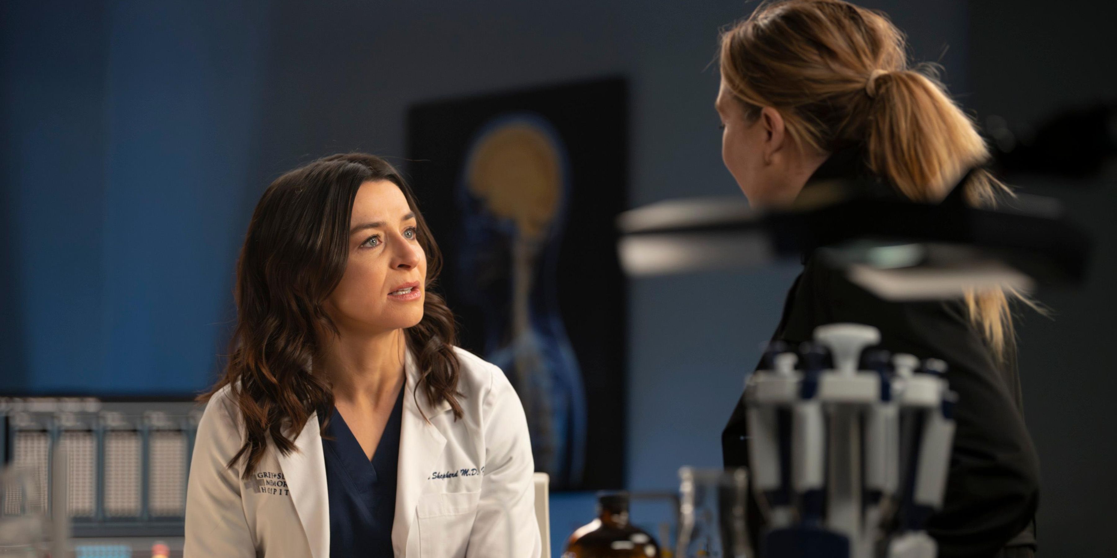 Amelia Shepherd and Meredith Grey looking at each other in a lab in 'Grey's Anatomy' Season 20