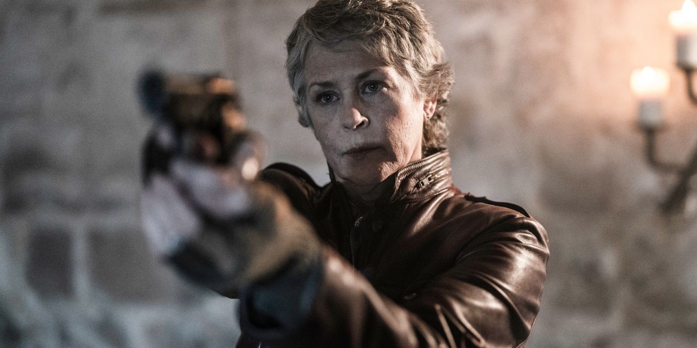 Melissa McBride's Carol pointing a gun in The Walking Dead: Daryl Dixon, Season 2 Episode 4