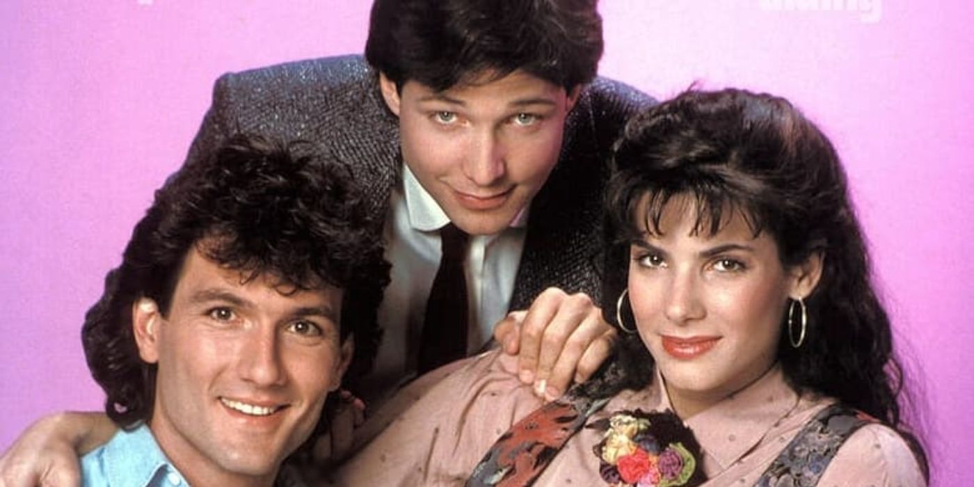 Tess, Everett, and Sal smile at the camera in the television series, Working Girl.
