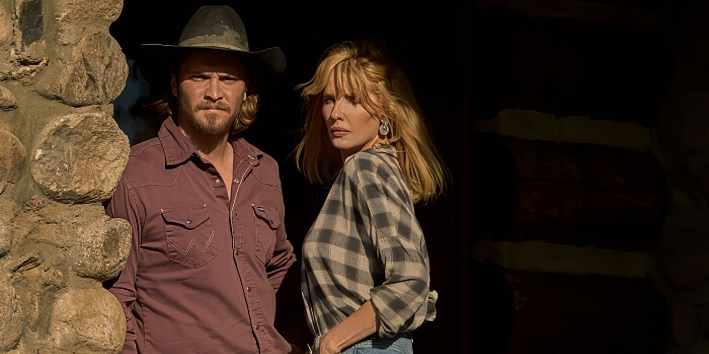 Luke Grimes and Kelly Reilly standing on the front porch of the ranch in Yellowstone Season 5