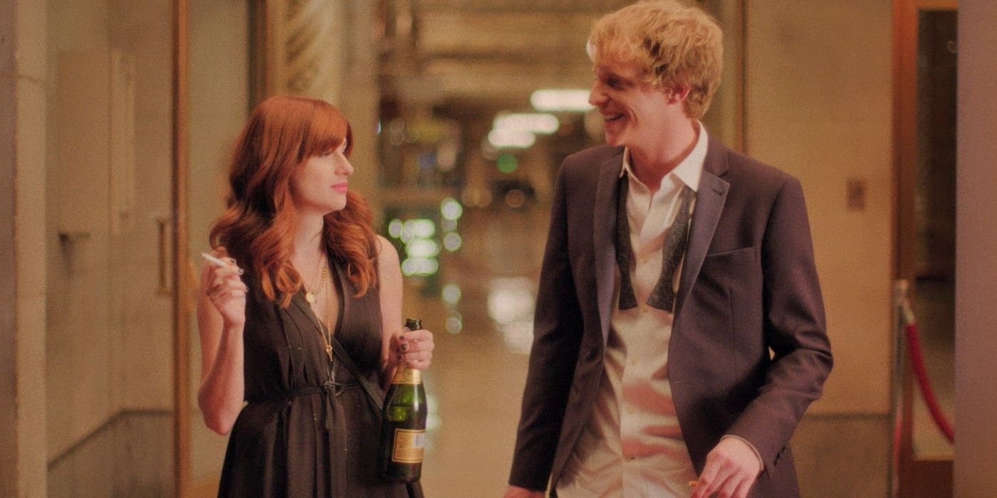 Gretchen and Jimmy talk in a hallway after a wedding. 