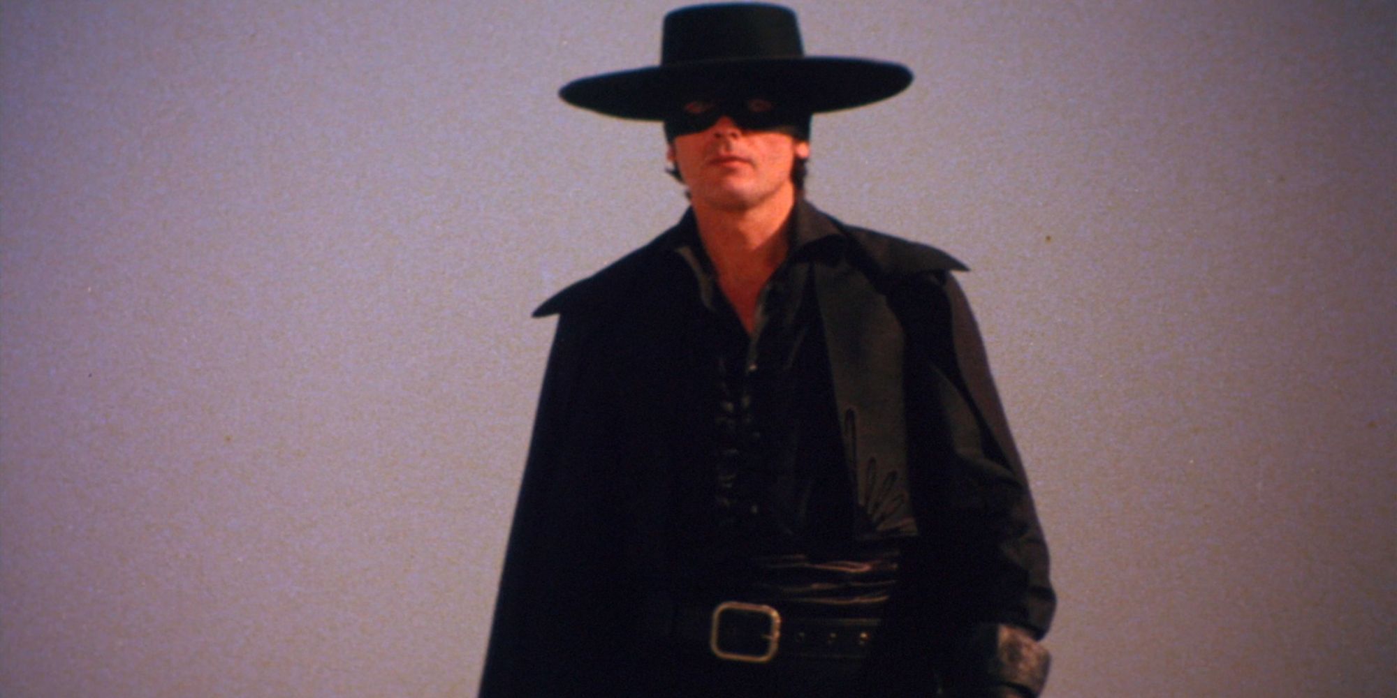 Alain Delon as Don Diego dressed as Zorro in all black with a hat and mask in Zorro - 1975