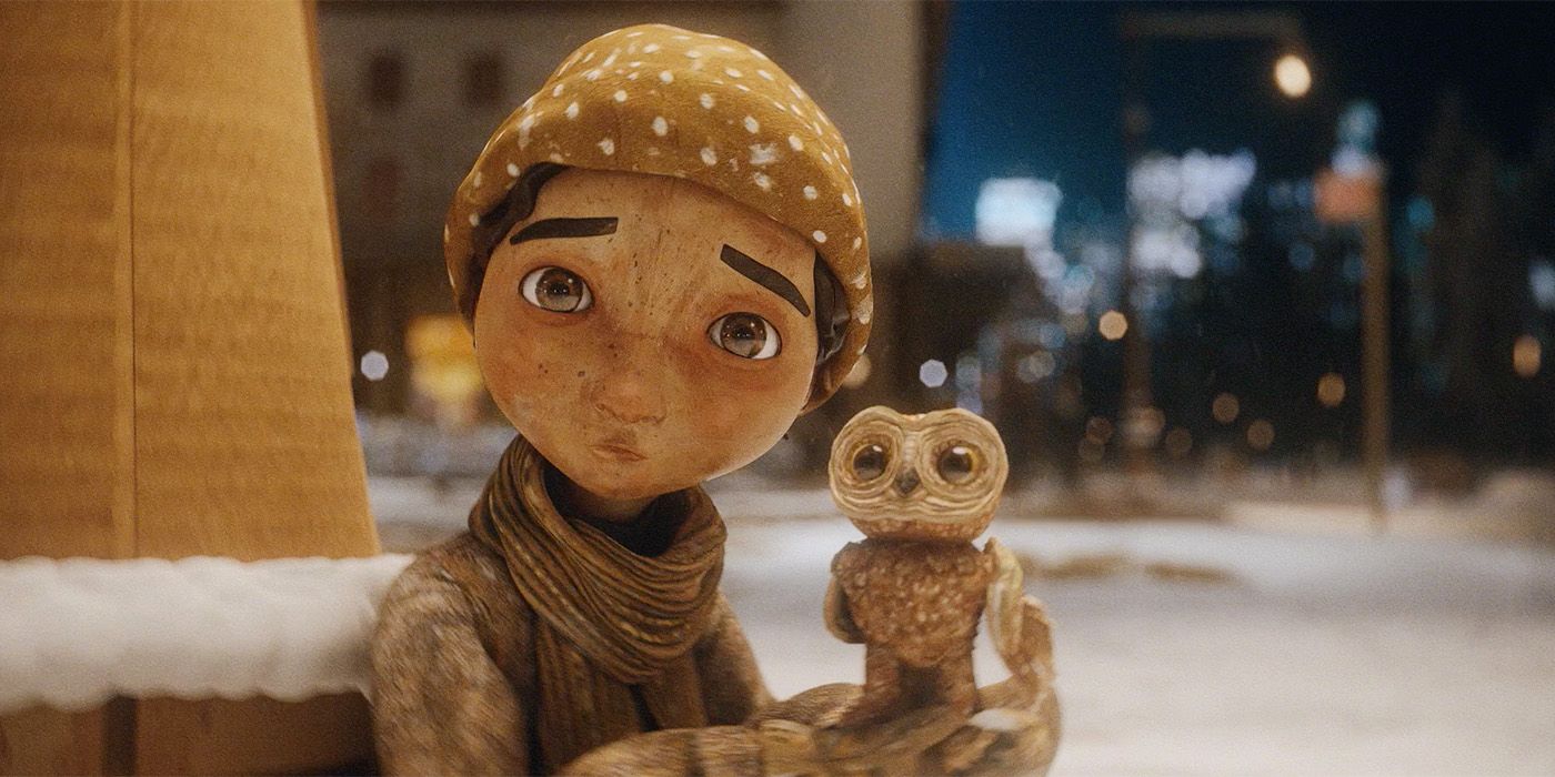 A boy holding an owl in An Almost Christmas Story