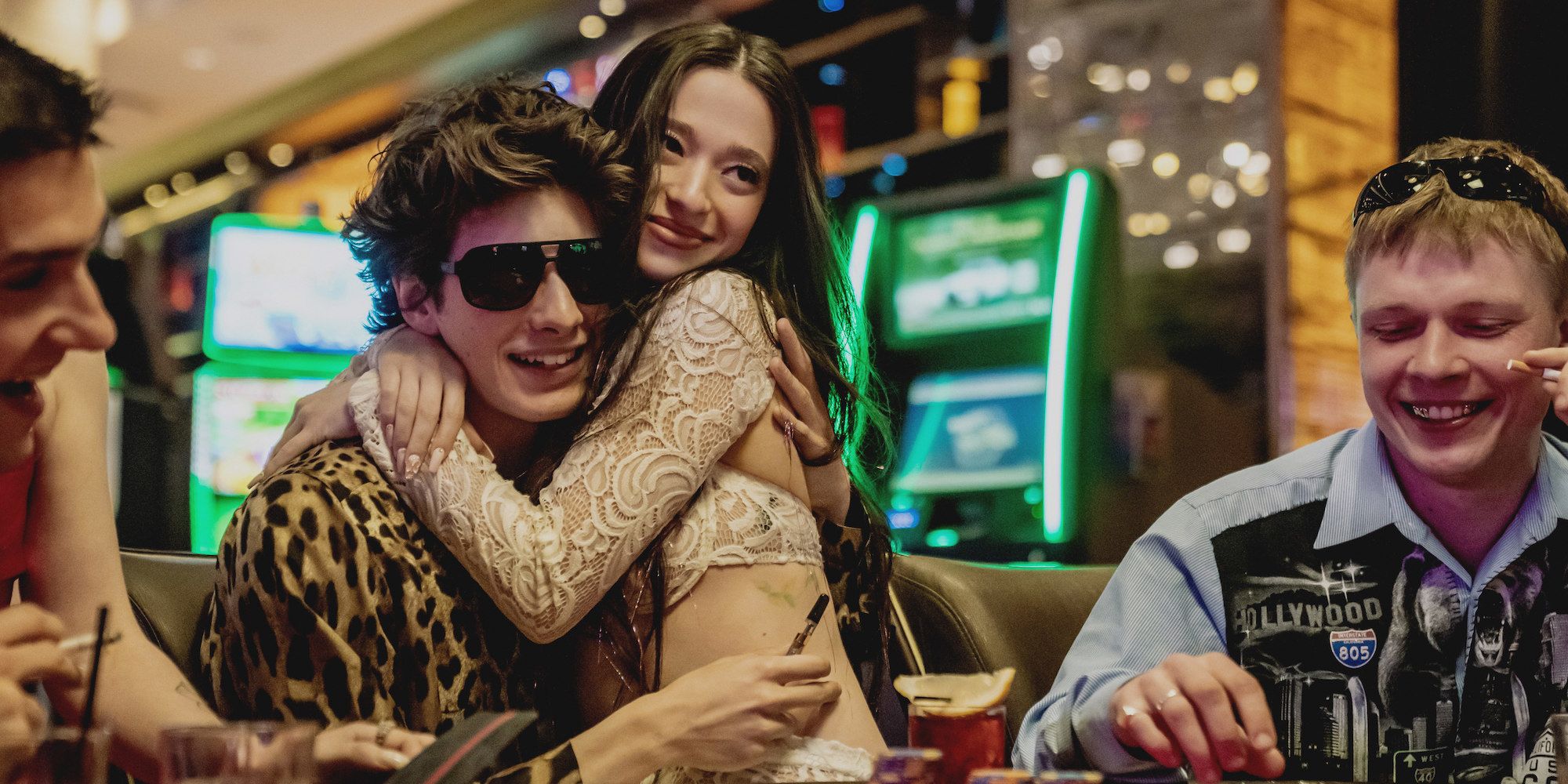 Mark Eydelshteyn as Ivan and Mikey Madison as Anora gambling in a casino in Anora