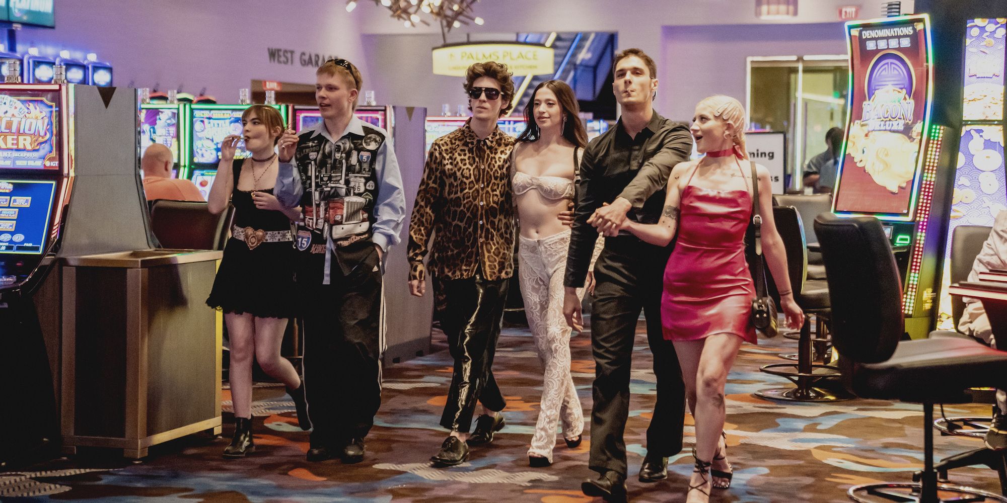 Ani (Mikey Madison), Ivan/Vanya (Mark Eydelshteyn) and their friends walking through the Vegas casino in Anora