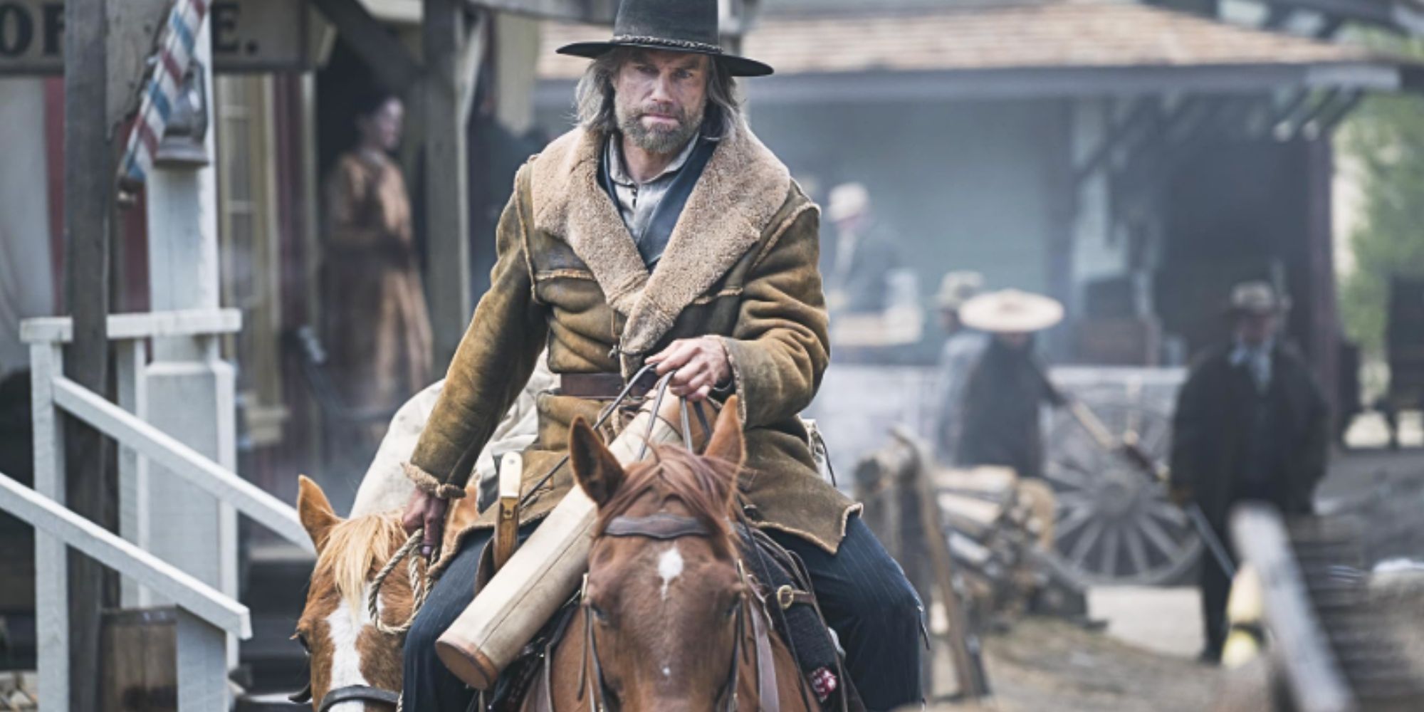 Anson Mount riding a horse while leading another one behind him in Hell on Wheels.