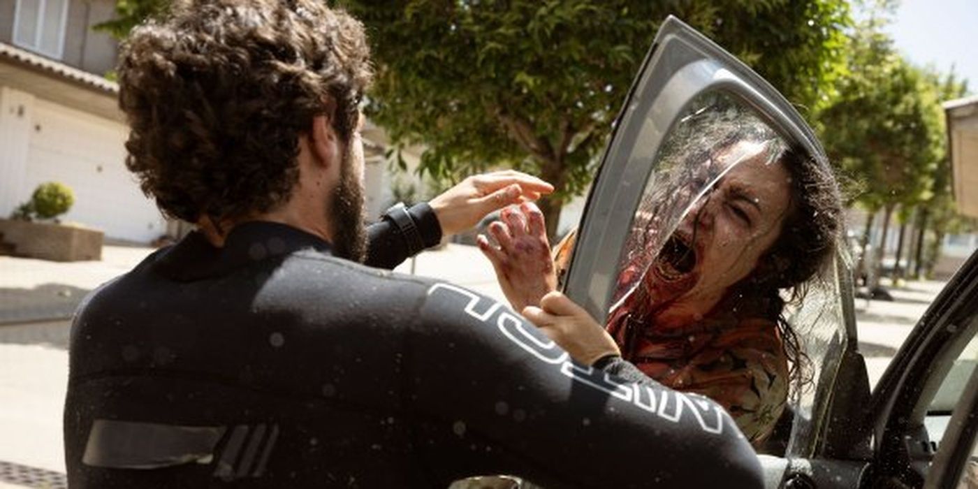 Carlos Ortiz as Manel fighting off a bloodthirsty zombie in &lsquo;Apocalypse Z: The Beginning of the End&rsquo; (2024)