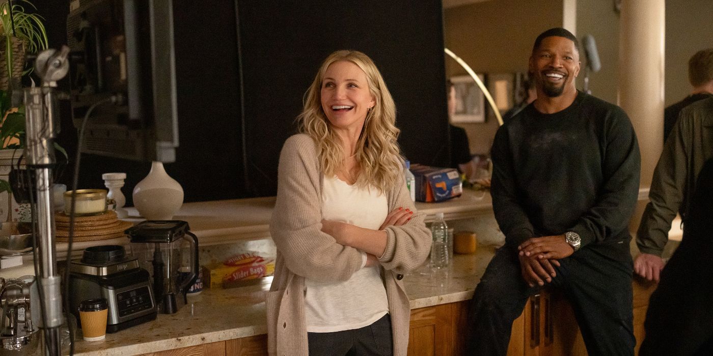 Cameron Diaz and Jamie Foxx smiling and laughing on the set of Back in Action.