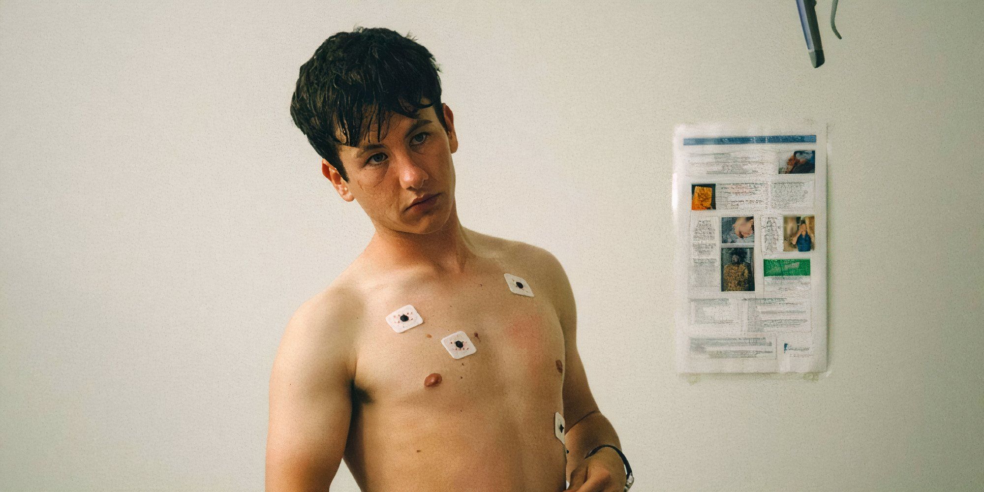 Barry Keoghan as Martin shirtless with wires attached to his chest in The Killing of a Sacred Deer.