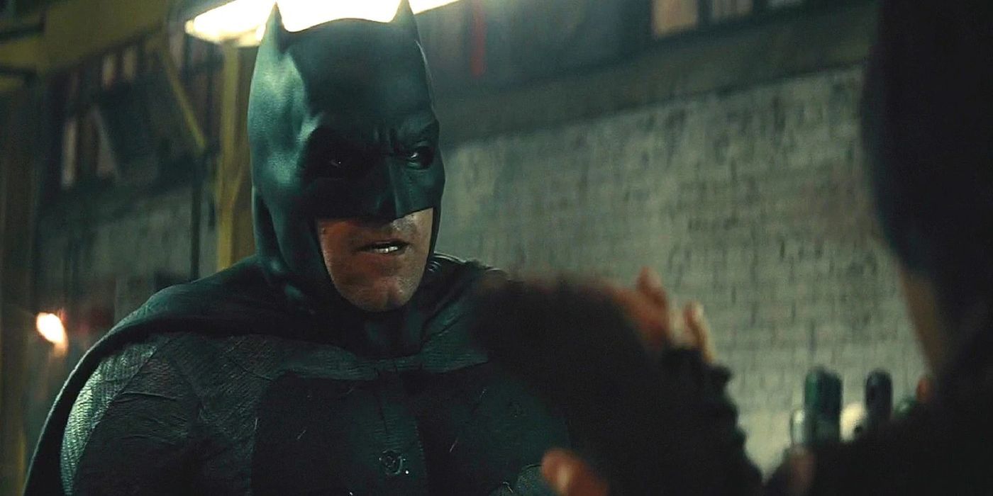 Batman talking to someone in a warehouse in Batman v Superman