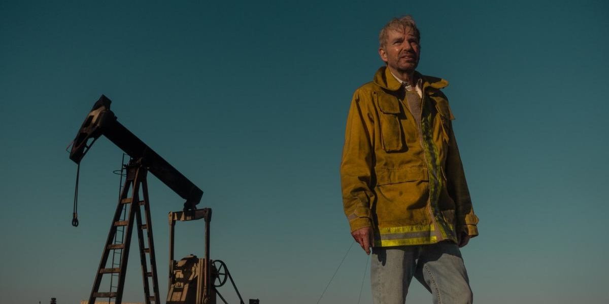 Billy Bob Thornton as Tommy Norris covered in soot on an oil field on 'Landman'