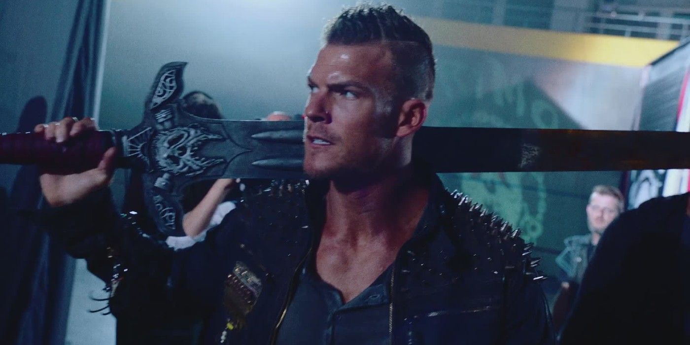 Alan Ritchson holding a sword in 'Blood Drive'