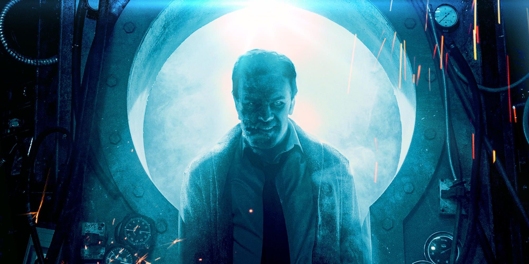 The figure of a man with a mutilated face emerges from machinery bathed in a blue light.