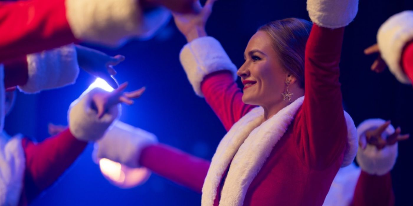 Britt Robertson wearing a Santa dress and dancing in &lsquo;The Merry Gentlemen&rsquo;.
