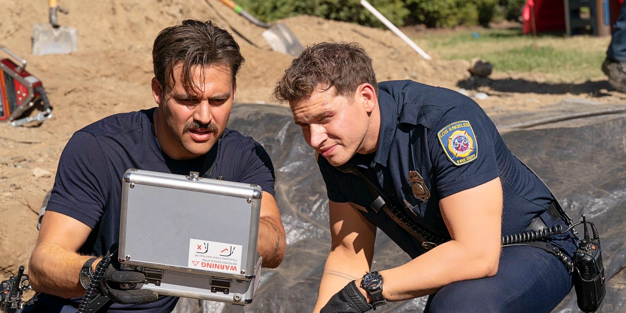 Buck and Eddie opening a medical kit in 9-1-1 Season 8