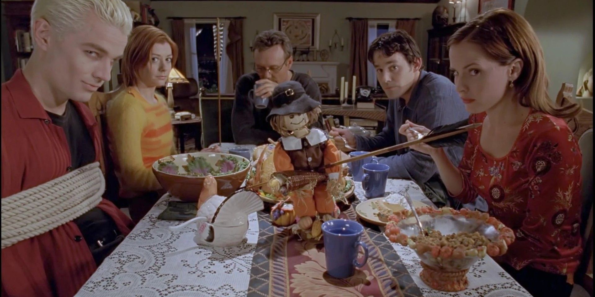 Spike (James Marsters), Willow (Alyson Hannigan) Giles (Anthony Head), Xander (Nicolas Brendon) enjoy and Anya (Emma Caulfield) enjoy a friendsgiving in Buffy The Vampire Slayer