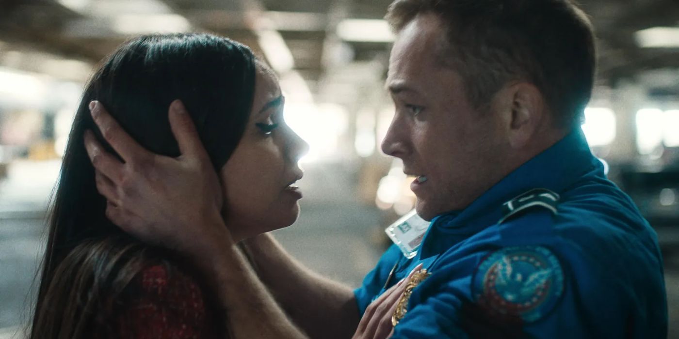 Taron Edgerton holding Sofia Carson&rsquo;s face, looking relieved in &lsquo;Carry-On&rsquo;.