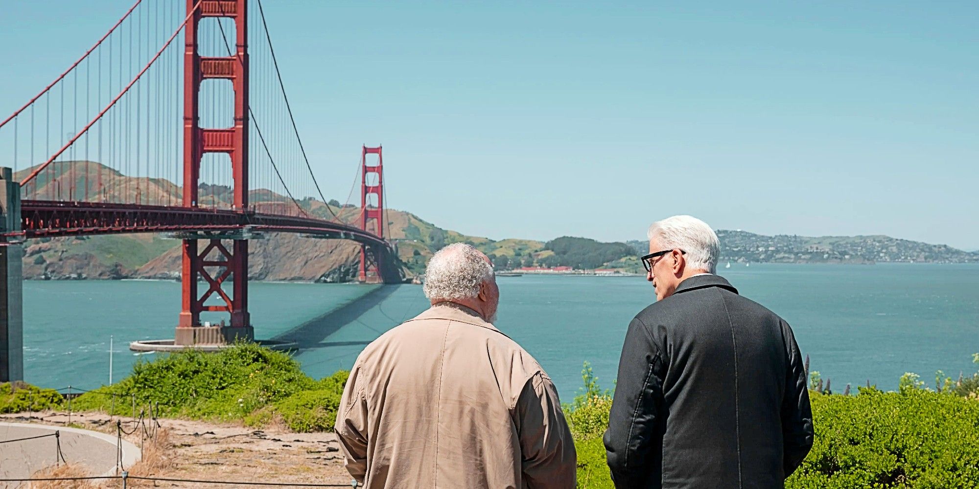 The backs of Calbert Graham and Charles Nieuwendyk overlooking The Golden Gate Bridge in A Man on the Inside