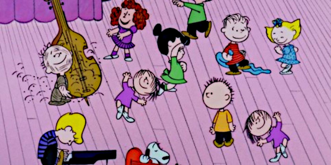 The Peanuts dance on stage in A Charlie Brown Christmas