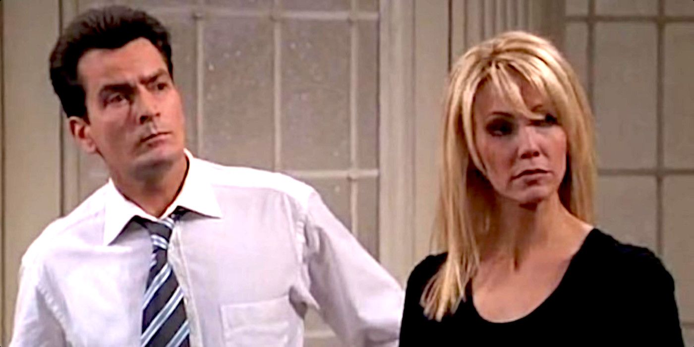 Charlie Crawford and Caitlin Moore look at something intently in Spin City