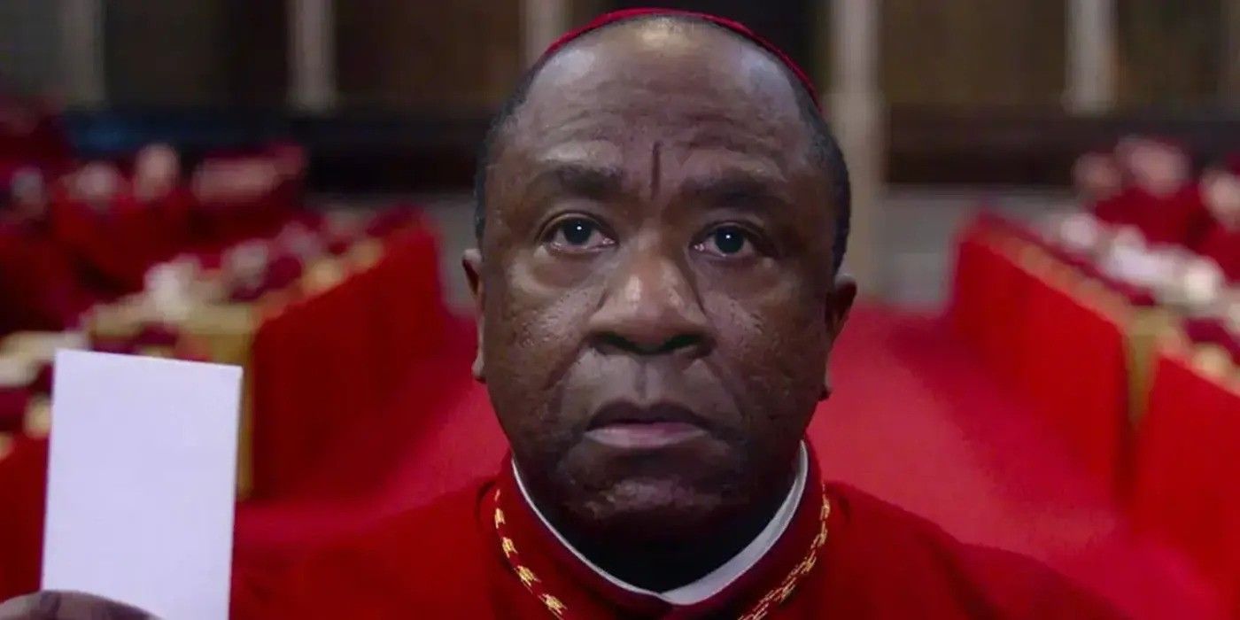 Lucian Msamati as Joshua Cardinal Adeyemi casting a vote for Pope in 'Conclave' 