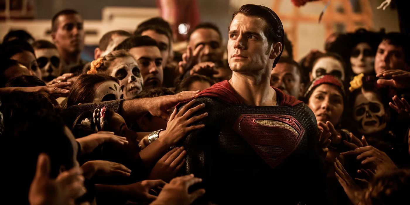 A crowd surrounding and touching Superman in Batman v Superman: Dawn of Justice