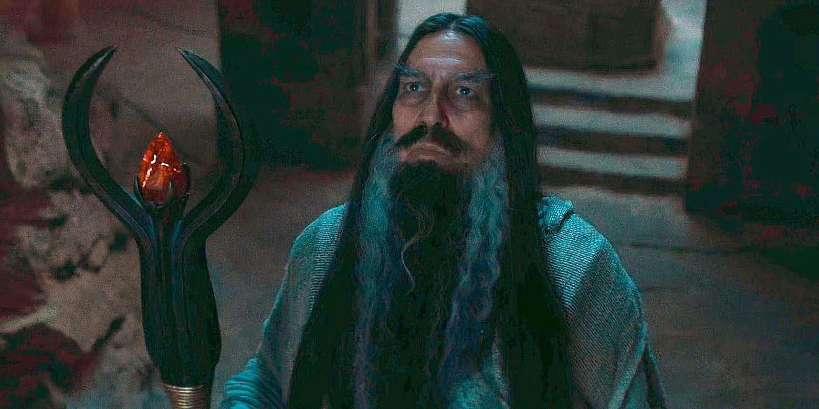 The Dark Wizard (Ciarán Hinds) looking up in The Lord of the Rings: the Rings of Power