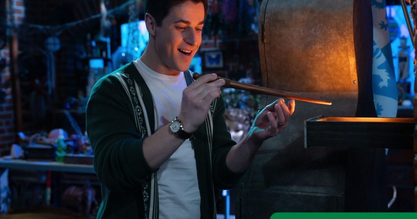 David Henrie looking at a magic wand