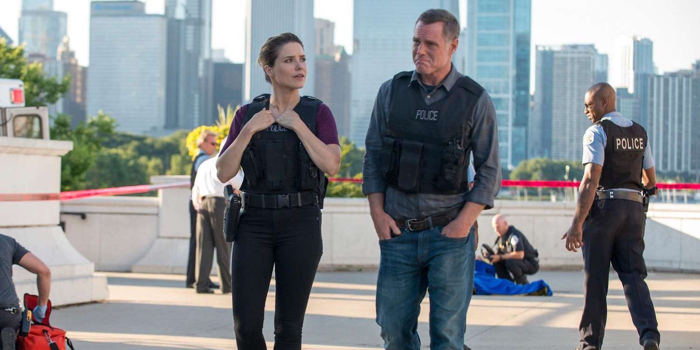 Detective Erin Lindsay (Sophia Bush) and Sergeant Hank Voight (Jason Beghe) walking away from crime scene in 'Chicago P.D.'