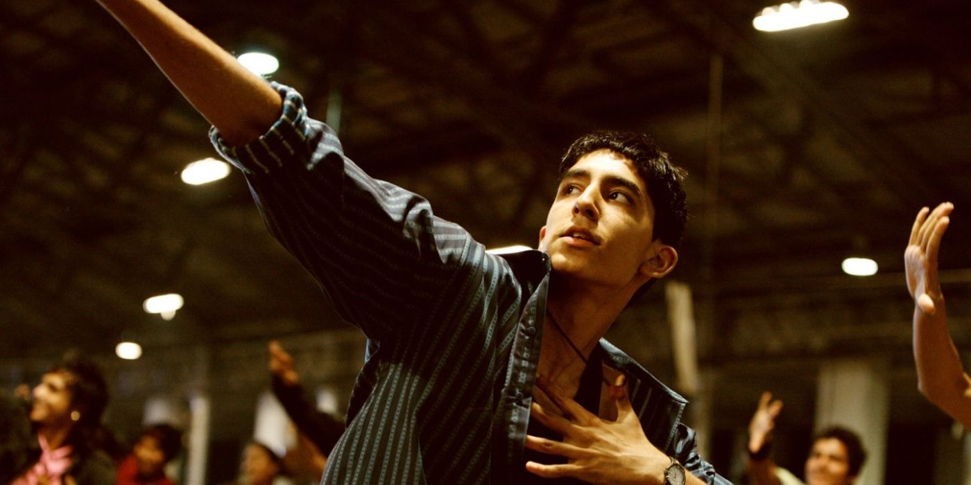 Dev Patel dancing as his character in Slumdog Millionaire.