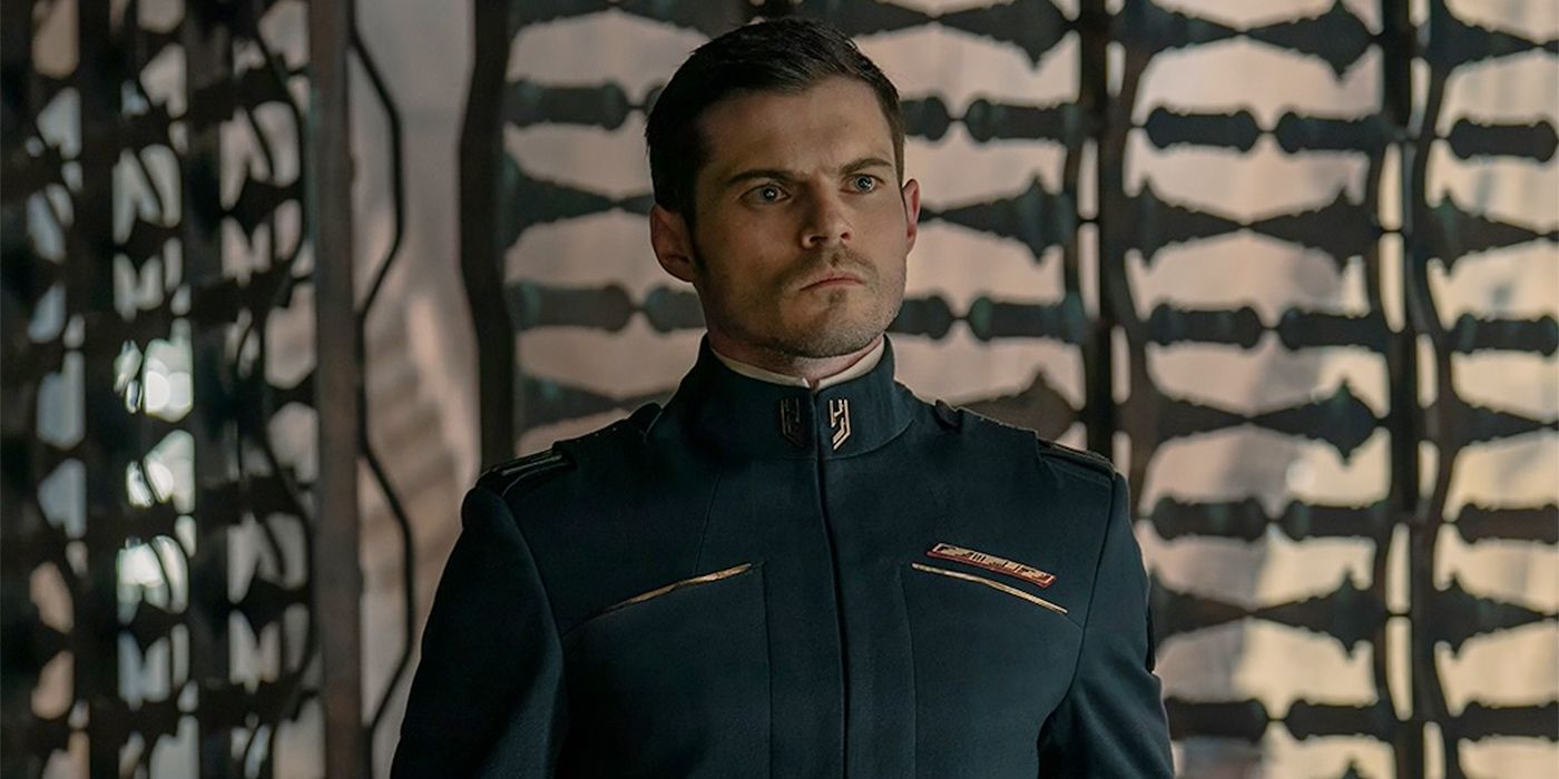 Close-up of Keirnan (Chris Mason) in his uniform frowning