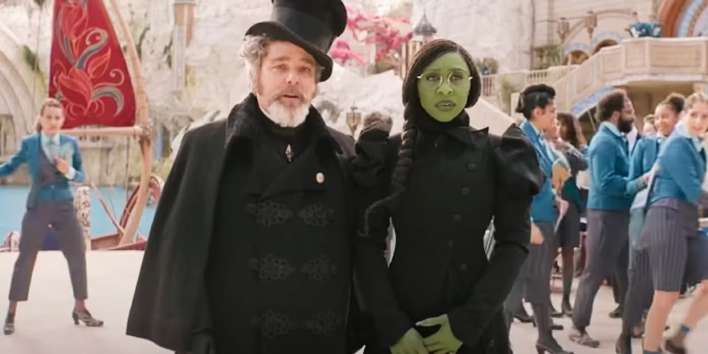Frexspar Thropp (Andy Nyman) and Elphaba (Cynthia Erivo) standing beside each other in Wicked