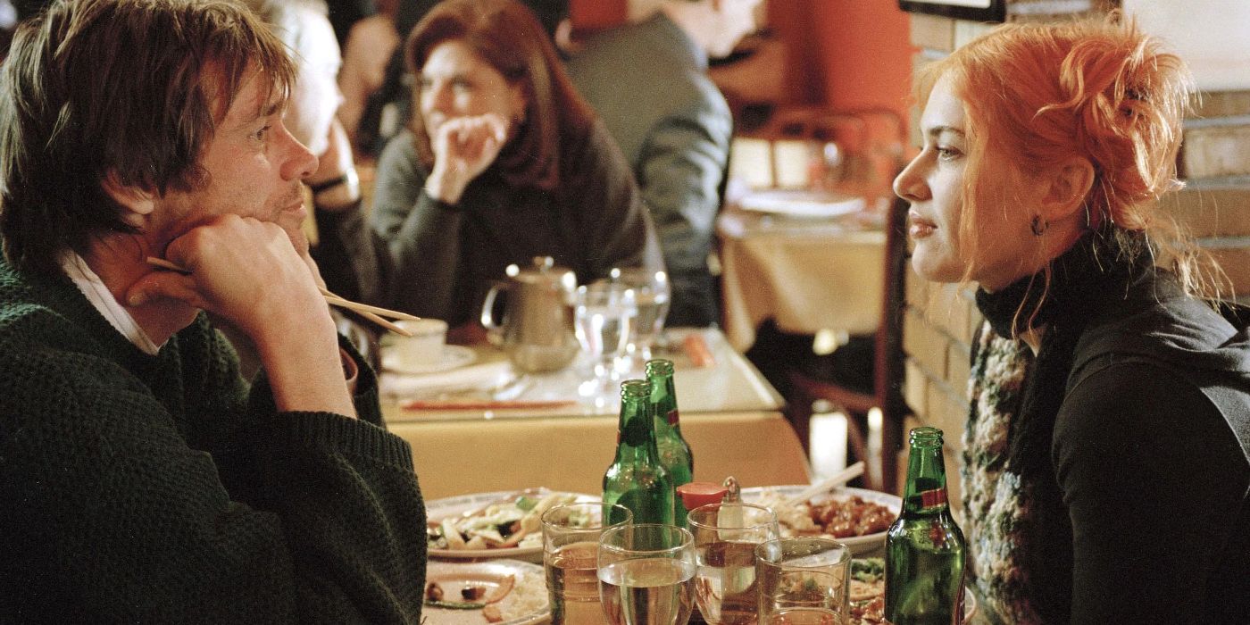 Joel and Clementine sit across from each other in a diner in Eternal Sunshine of the Spotless Mind.