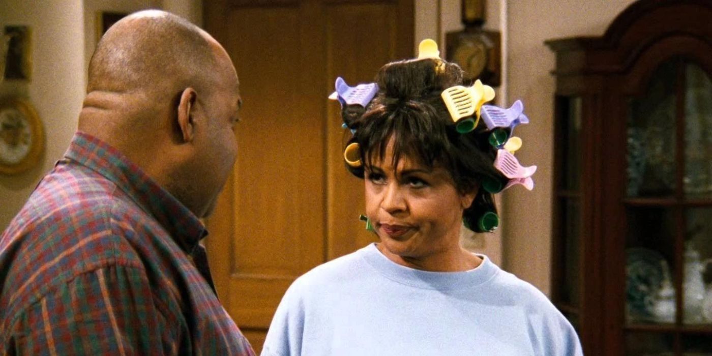 Harriet with curlers in her hair looking at her husband unimpressed in Family Matters
