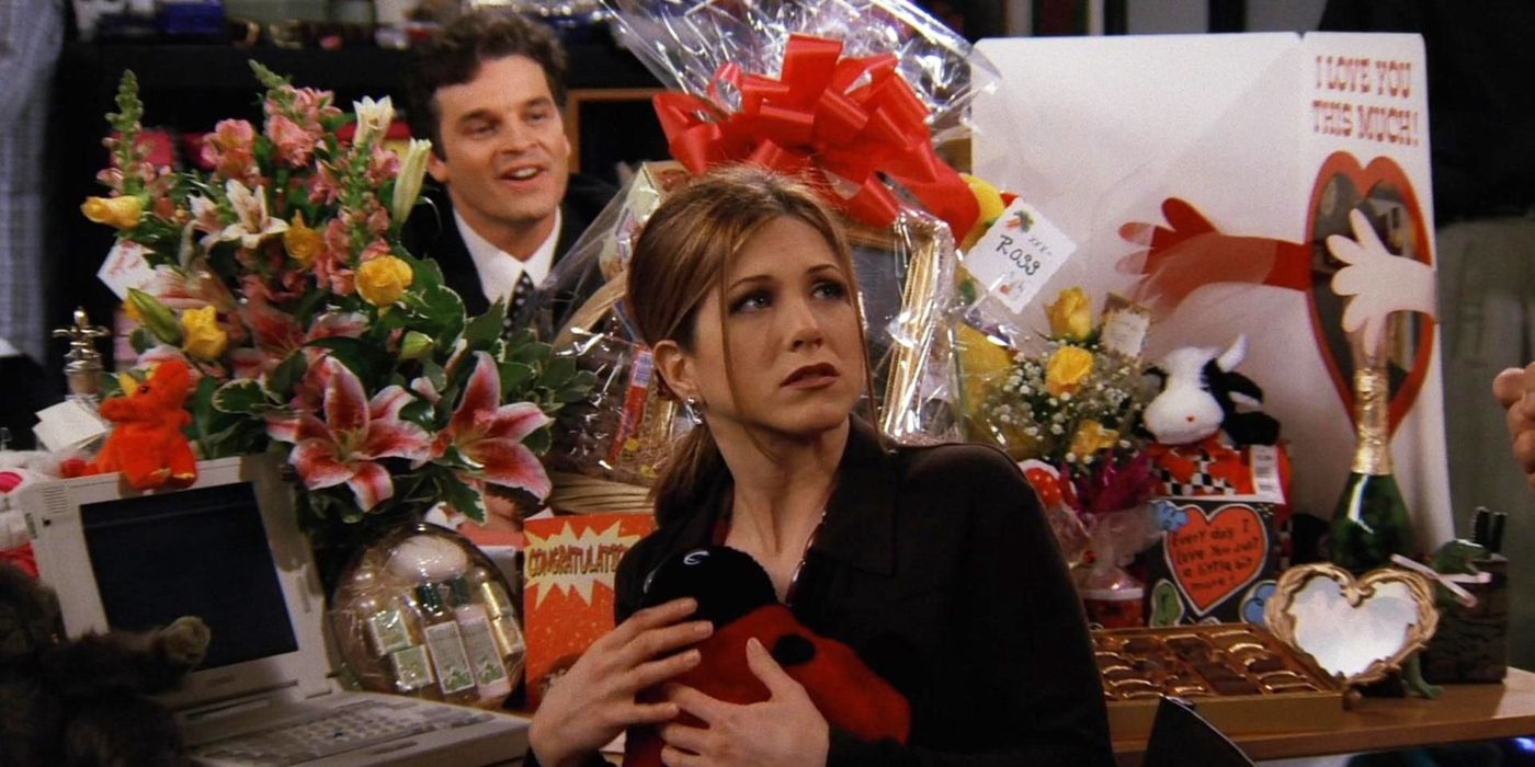 Rachel surrounded by gifts from Ross while at work in Friends 