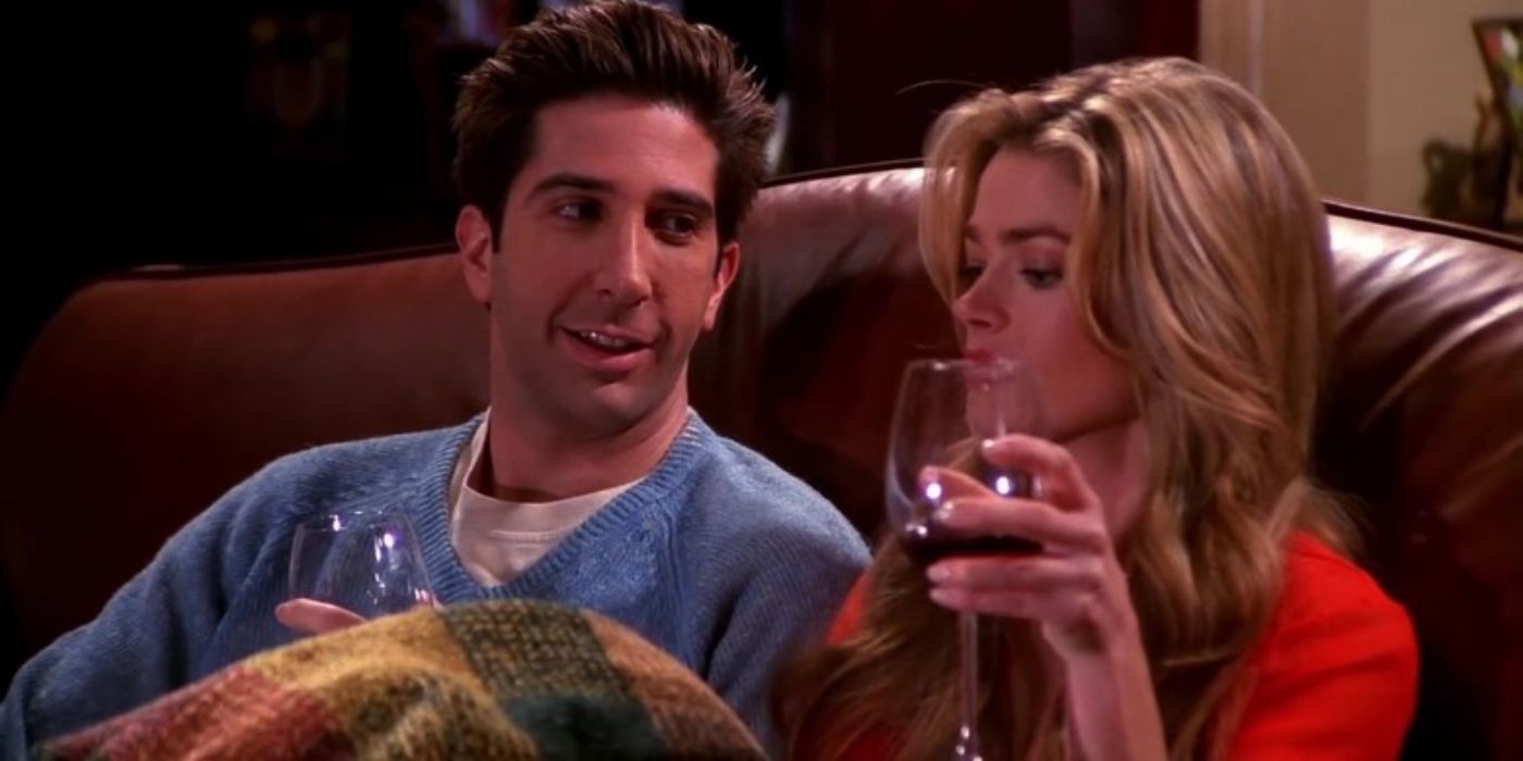 Ross and his cousin Cassie sitting on a couch together drinking wine in Friends. 