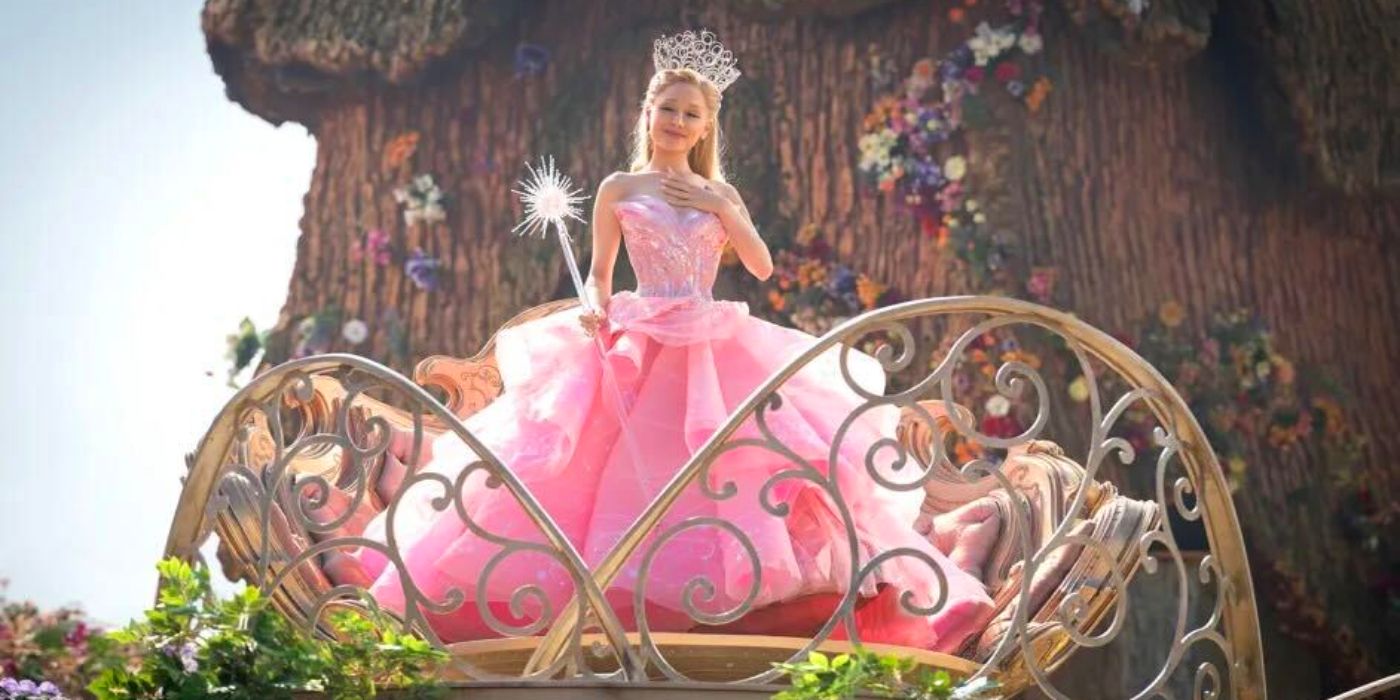 Ariana Grande as Glinda the Good stands on an ornate platform in Munchkinland in 'Wicked'.?